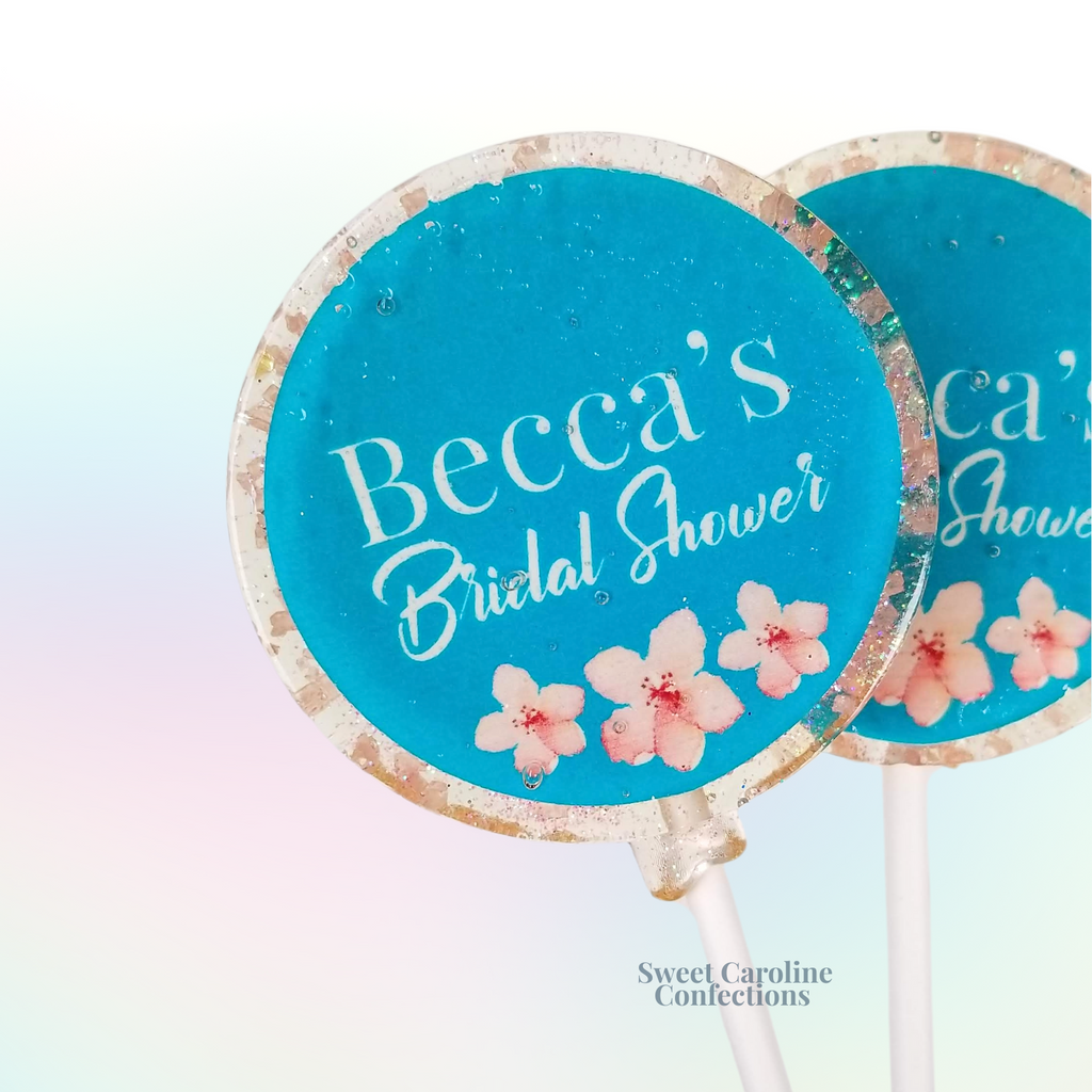 Personalized bridal shower lollipops with custom text and gold sparkles.