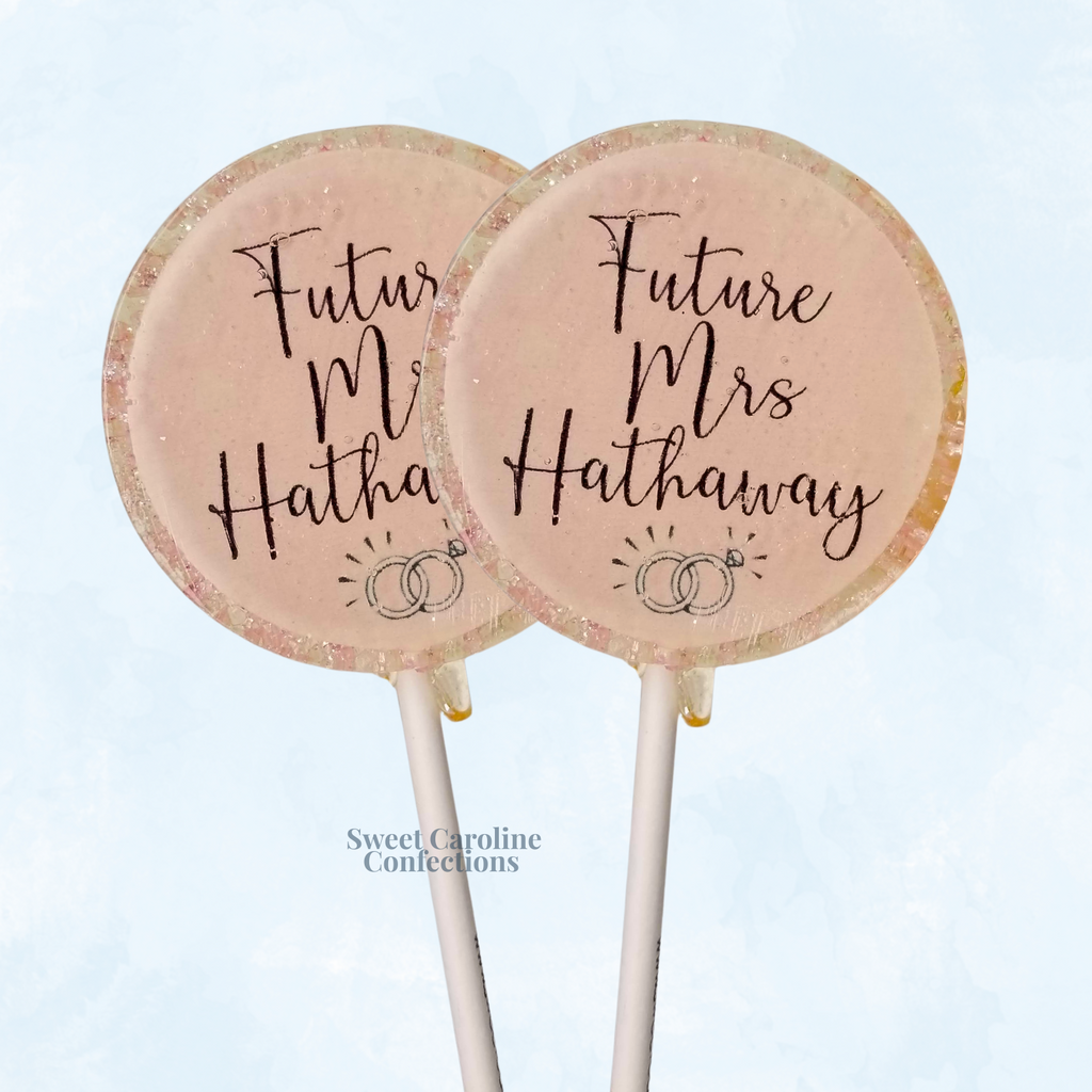 Custom Future Mrs. lollipops with light pink edible image and gold sparkles.