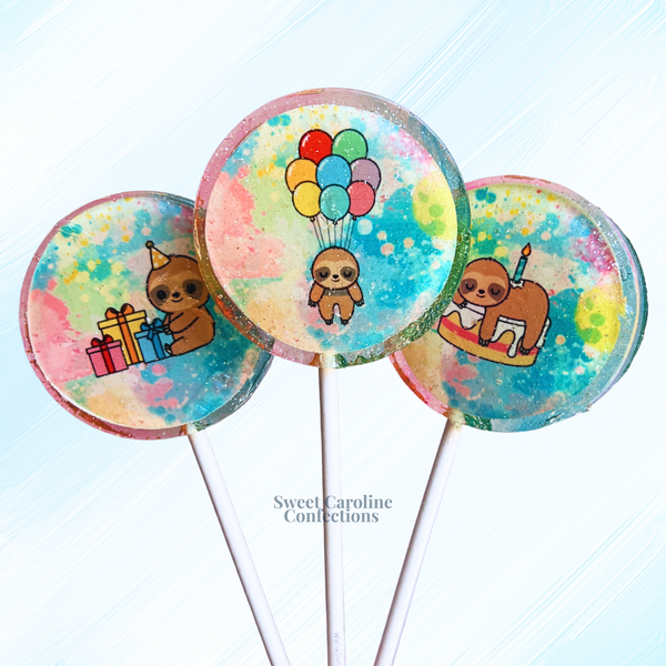Adorable sloth lollipops holding colorful birthday balloons with iridescent sparkles, ideal for a slow and sweet celebration.