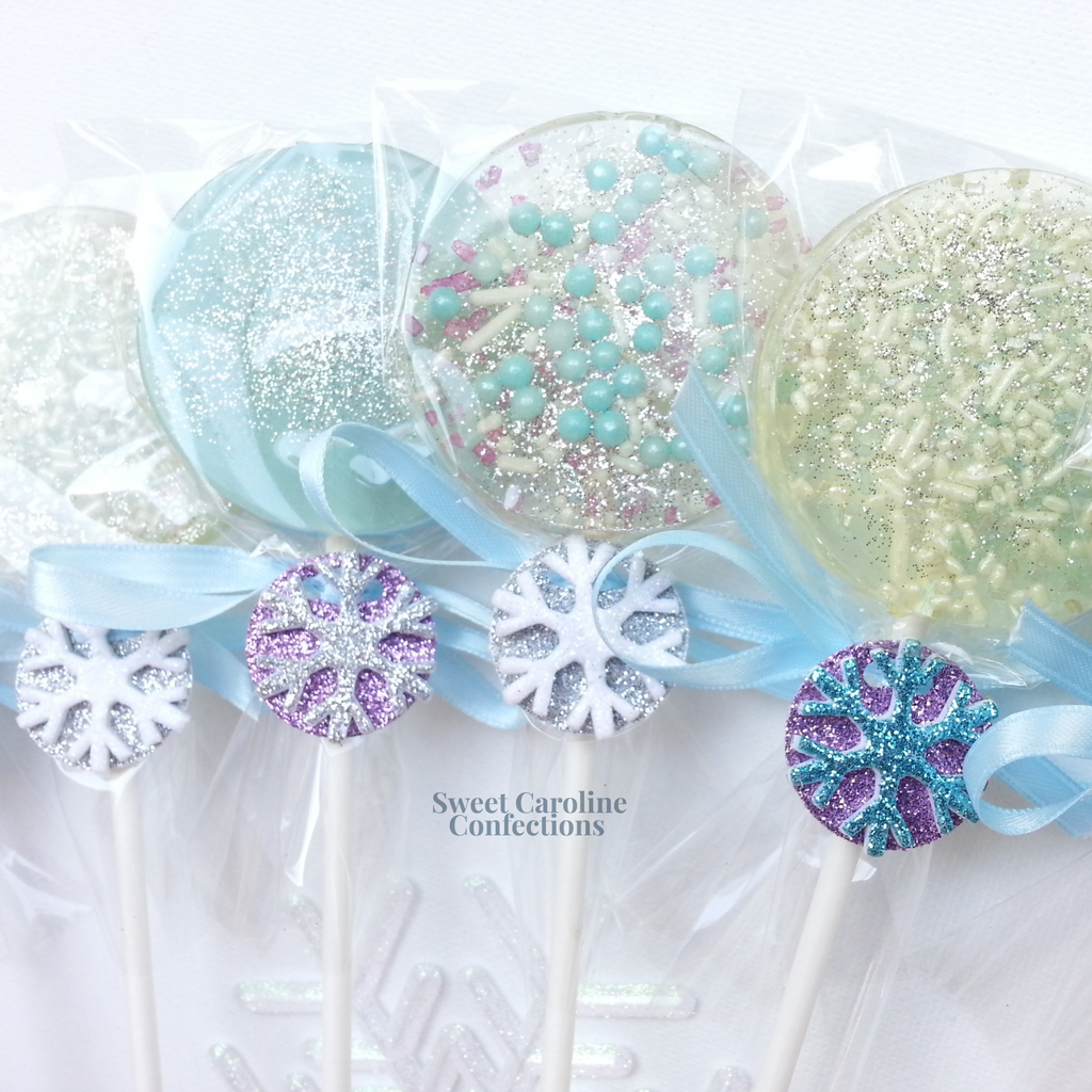 Blue and white frozen themed sparkle lollipops with a snowflake gift tag.