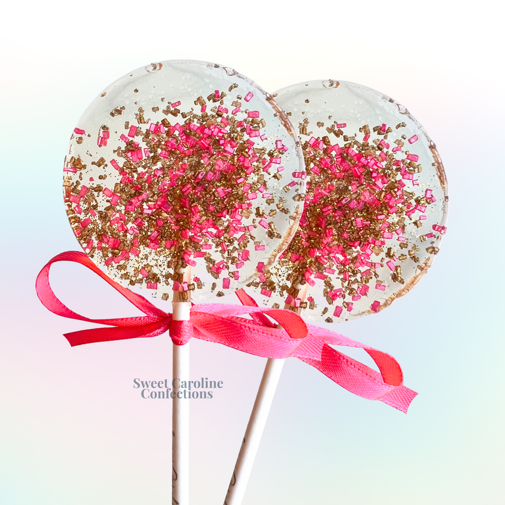 Gold and hot pink sparkle lollipops with edible glitter