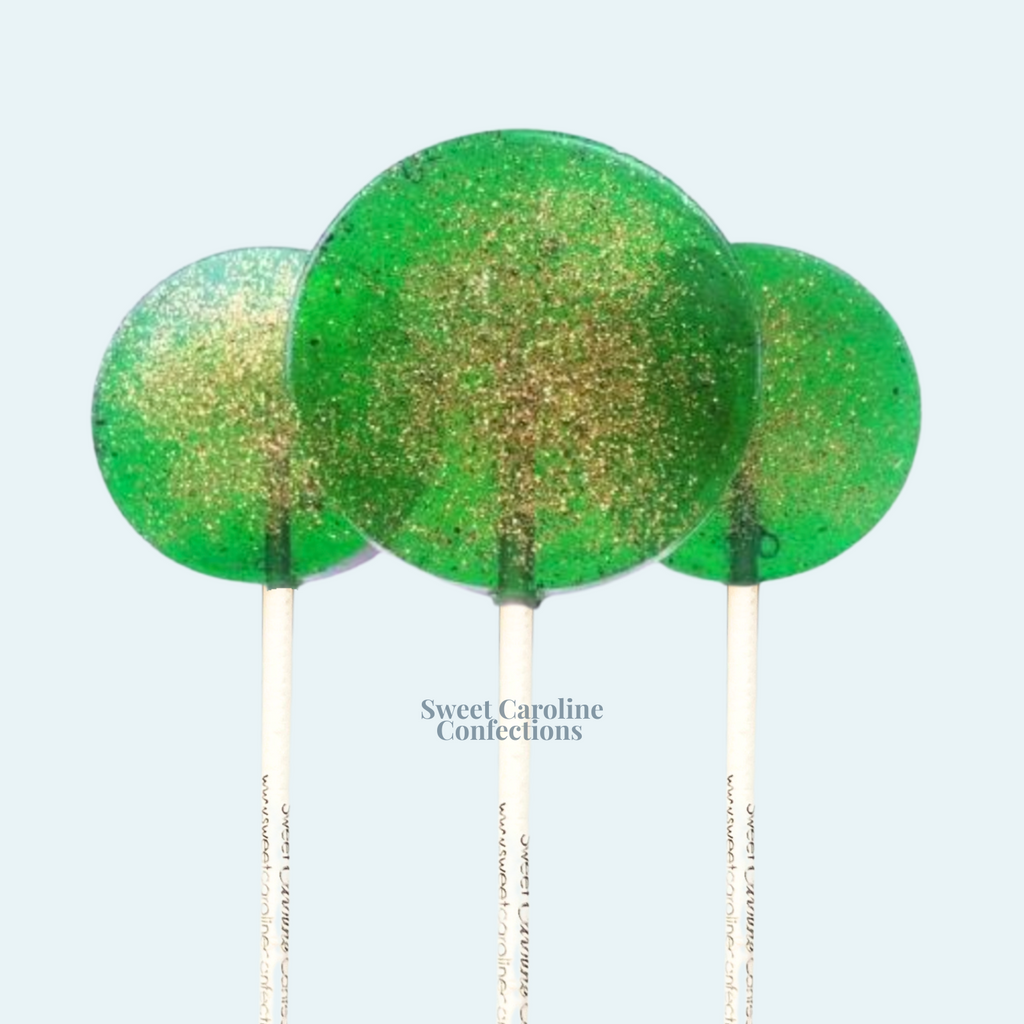 Vibrant green lollipops with shimmering gold glitter
