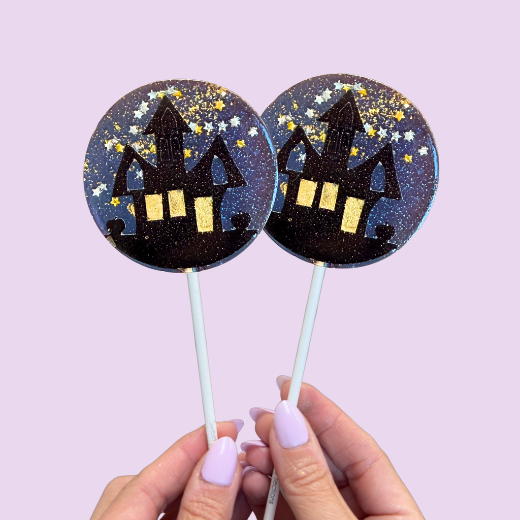 Haunted house Halloween lollipops in spooky seasonal designs, handcrafted by Sweet Caroline Confections.