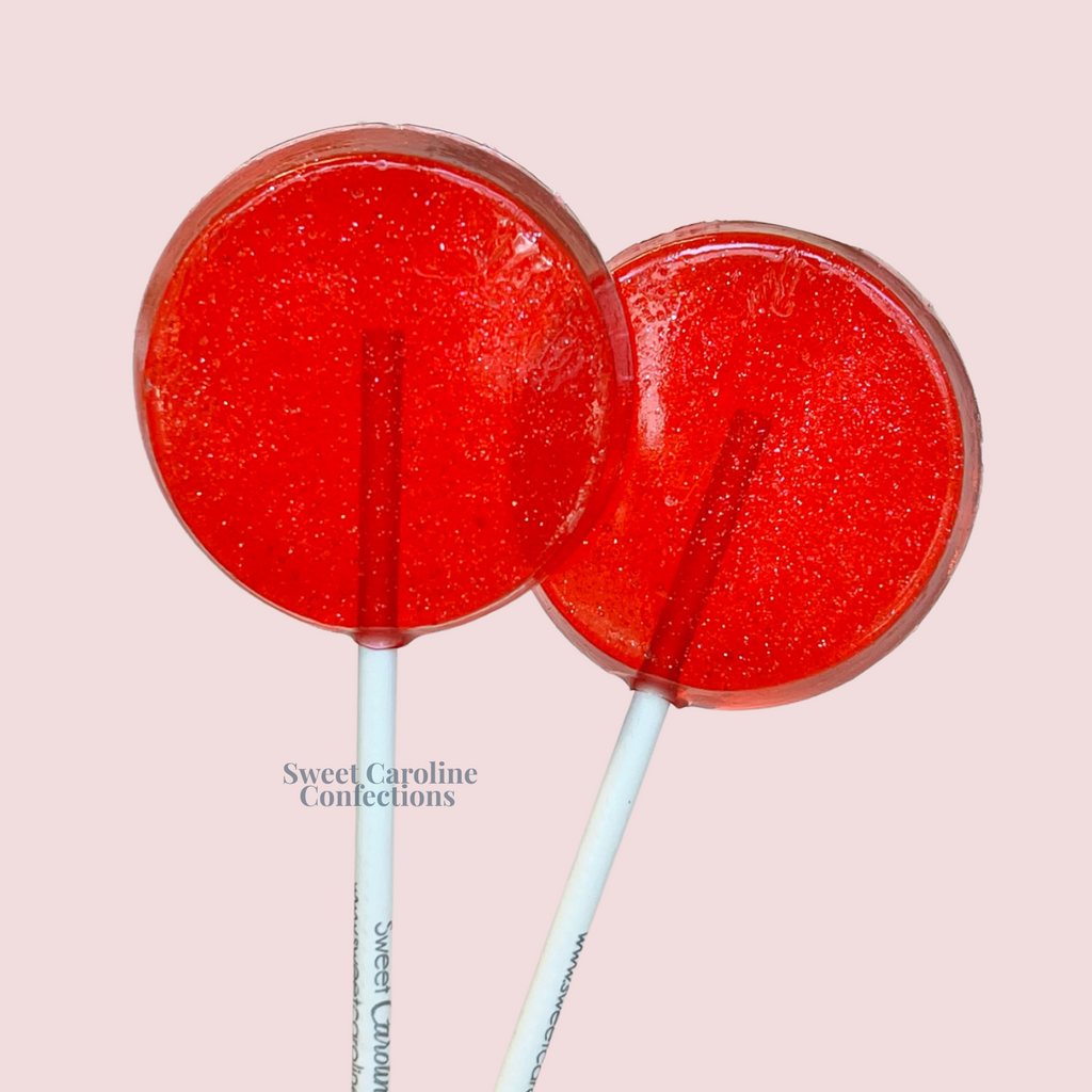Bright red hot cinnamon sparkle lollipops infused with iridescent edible glitter.