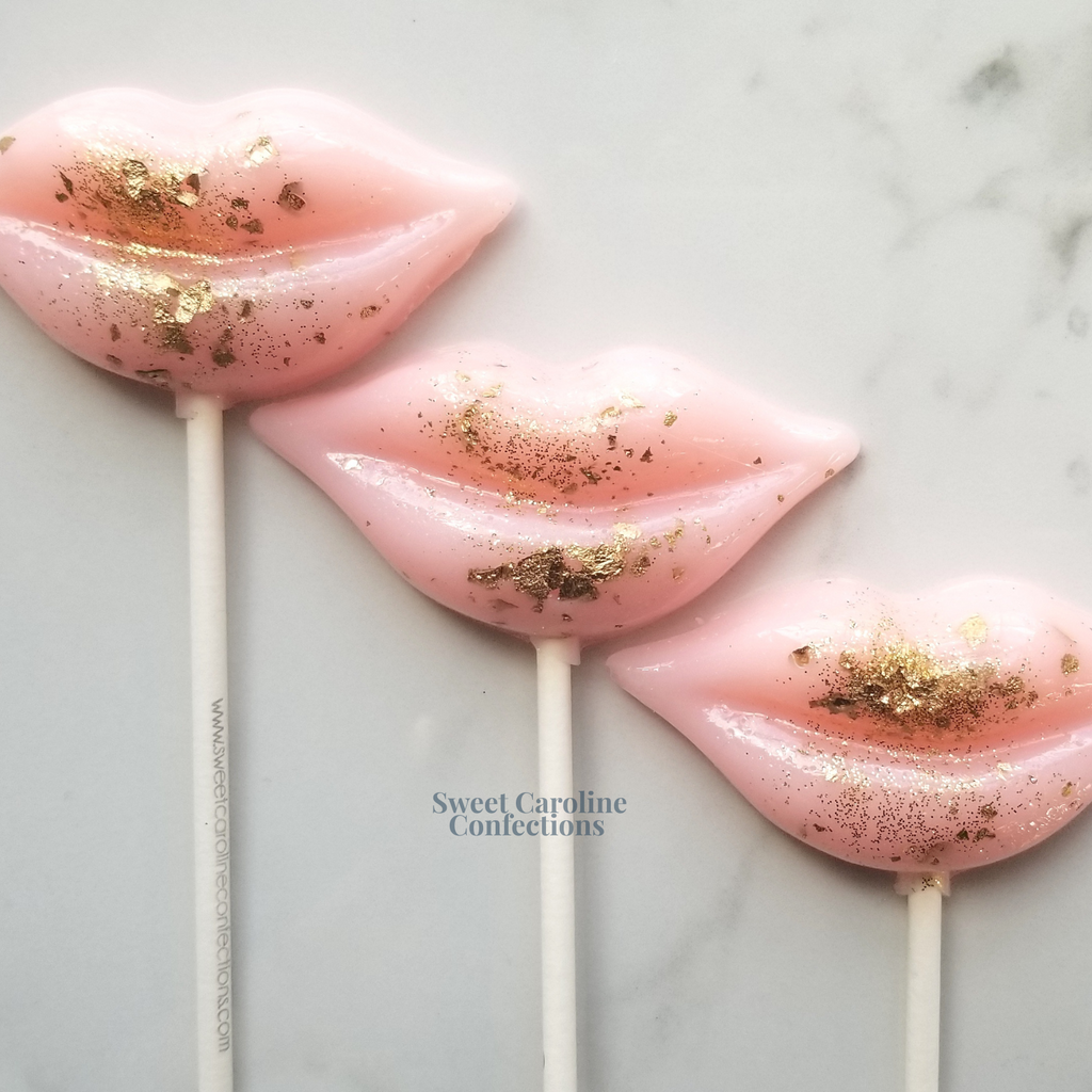  Light pink and gold lip shaped sparkle lollipops with edible gold flakes.