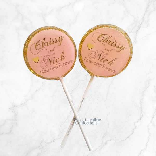 Light pink and gold sparkle lollipops for romantic wedding favors.
