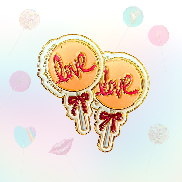 White enamel pin with "Love" written in sweet script and sparkle accents.