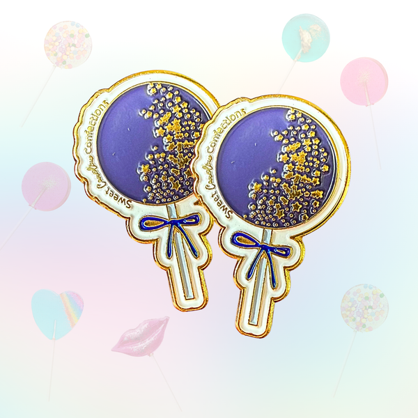 Navy blue galaxy sparkle lollipop enamel pin with celestial details.