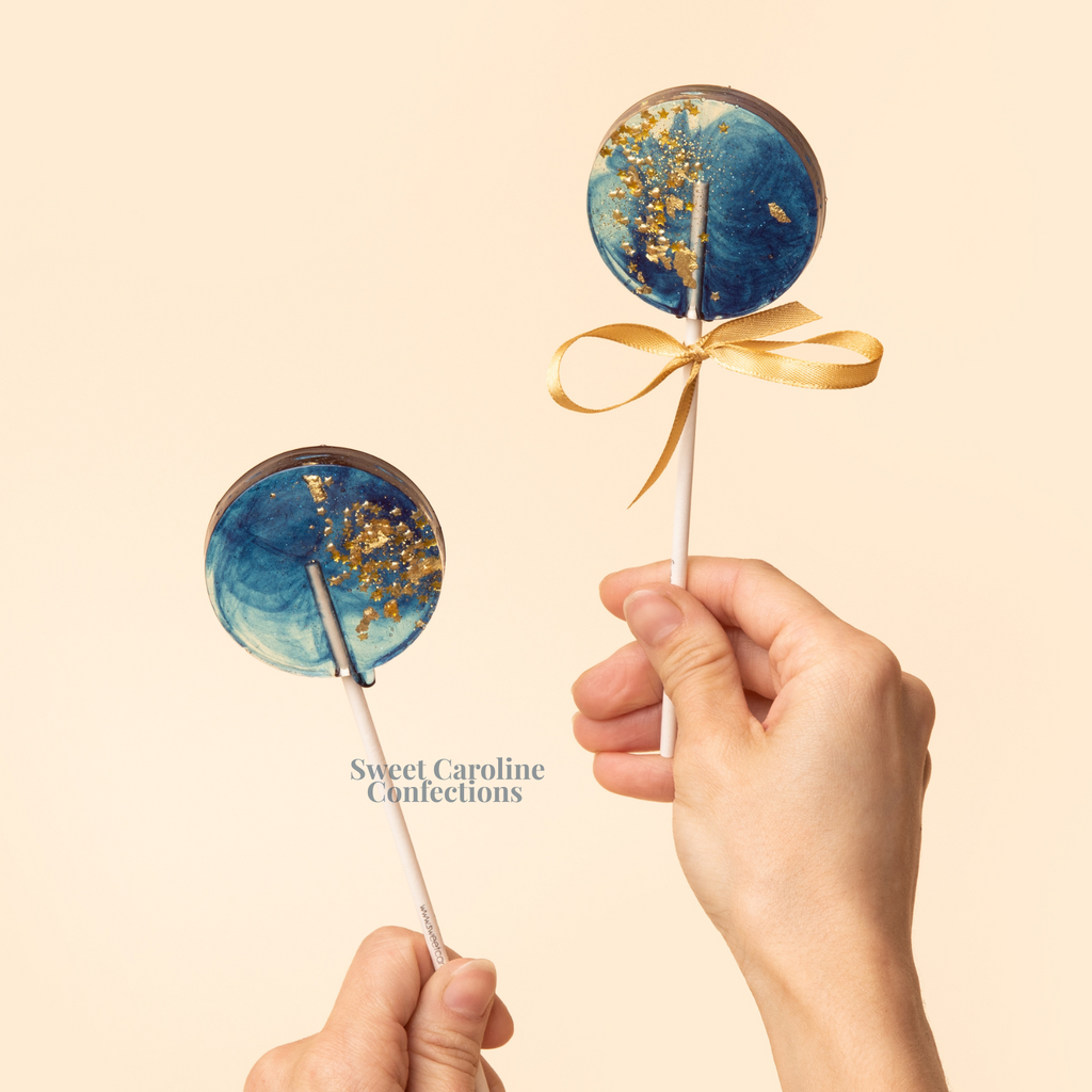 Deep navy blue sparkle lollipops with gold stars.