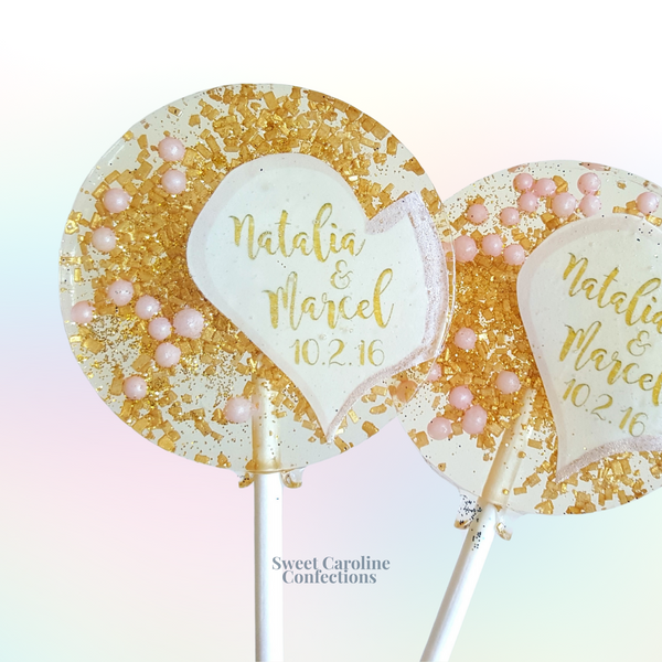 Pink and gold sparkle wedding lollipops with edible glitter and gold flakes.