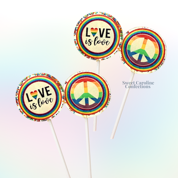 Gourmet lollipops with multi-colored layers representing the Pride flag, flavored with rainbow sorbet and infused with sparkle.