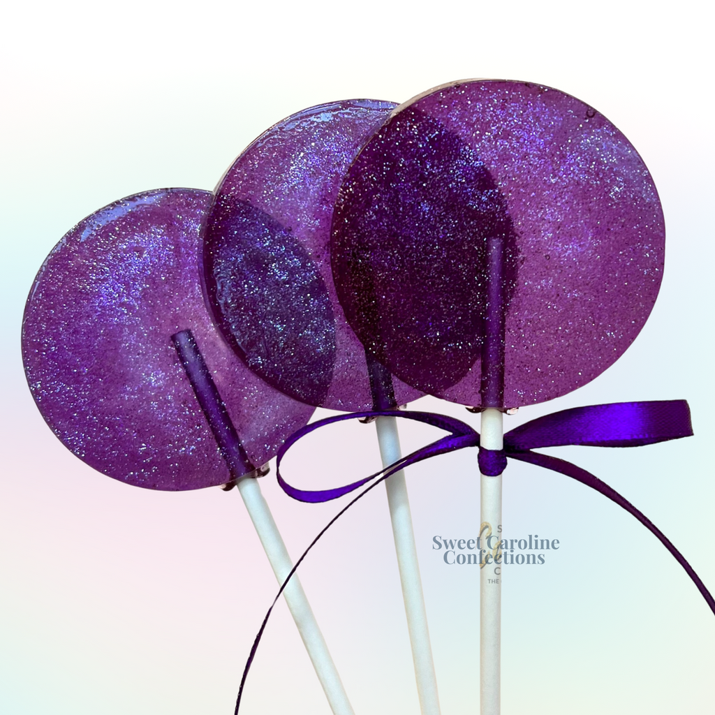 Vibrant purple grape flavored lollipops with purple edible sparkles.