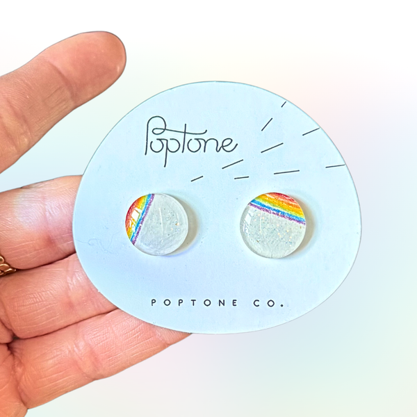 Colorful rainbow resin stud earrings in the shape of sparkle lollipops.