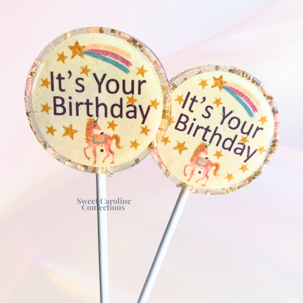 Whimsical rainbow and unicorn-themed lollipops with "It's Your Birthday" text and colorful sparkles for a magical celebration.
