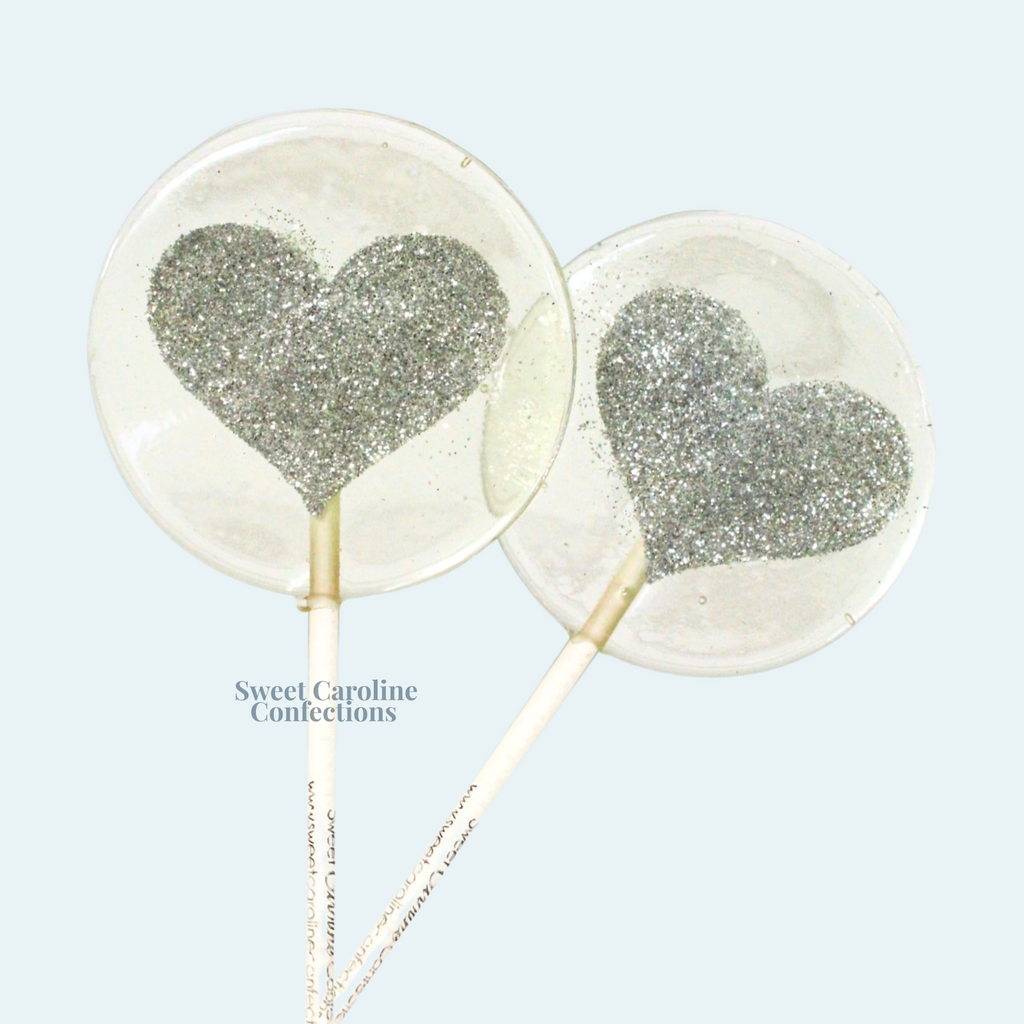 Silver heart shaped sparkle lollipops for weddings
