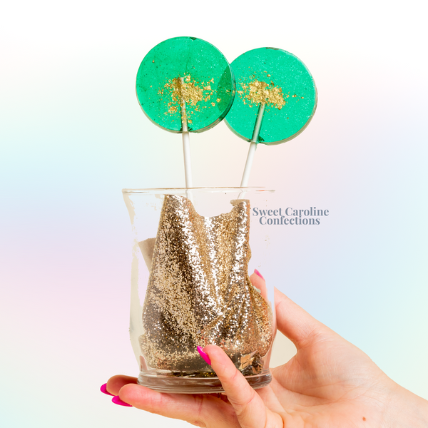 Teal and gold sparkle lollipops with edible glitter.