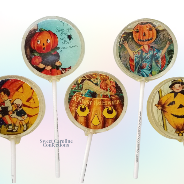 Vintage Halloween collection lollipops with classic spooky designs in clear sparkle candy from Sweet Caroline Confections.

