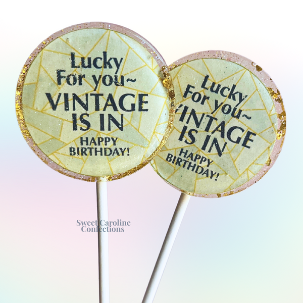 "Lucky For You Vintage is In" themed lollipops with a retro design and gold sparkles for a humorous gift.