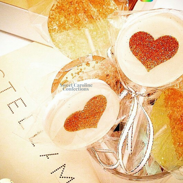 White heart shaped lollipops with gold sparkle